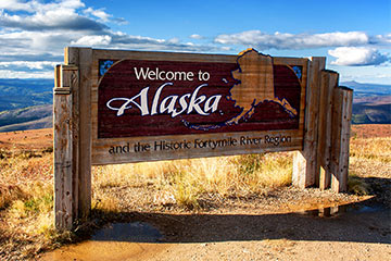 Brown and red sign that reads